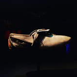 Before and after image of a shoe with background removed and colors enhanced.
