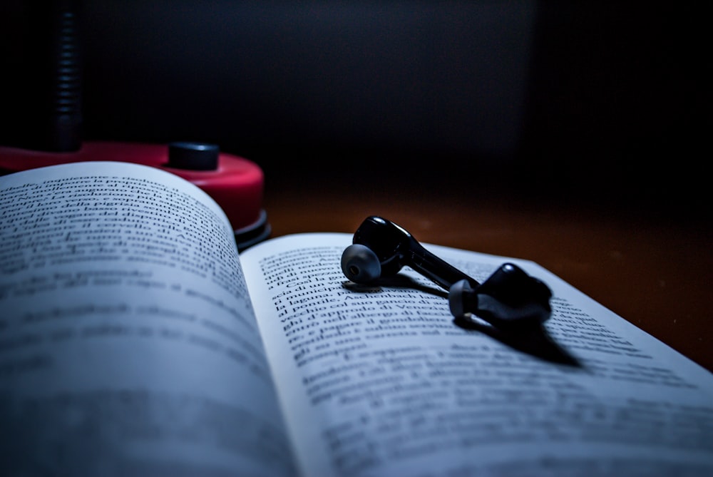 black earpiece on book page