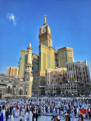 brown and white concrete building under blue sky at daytime