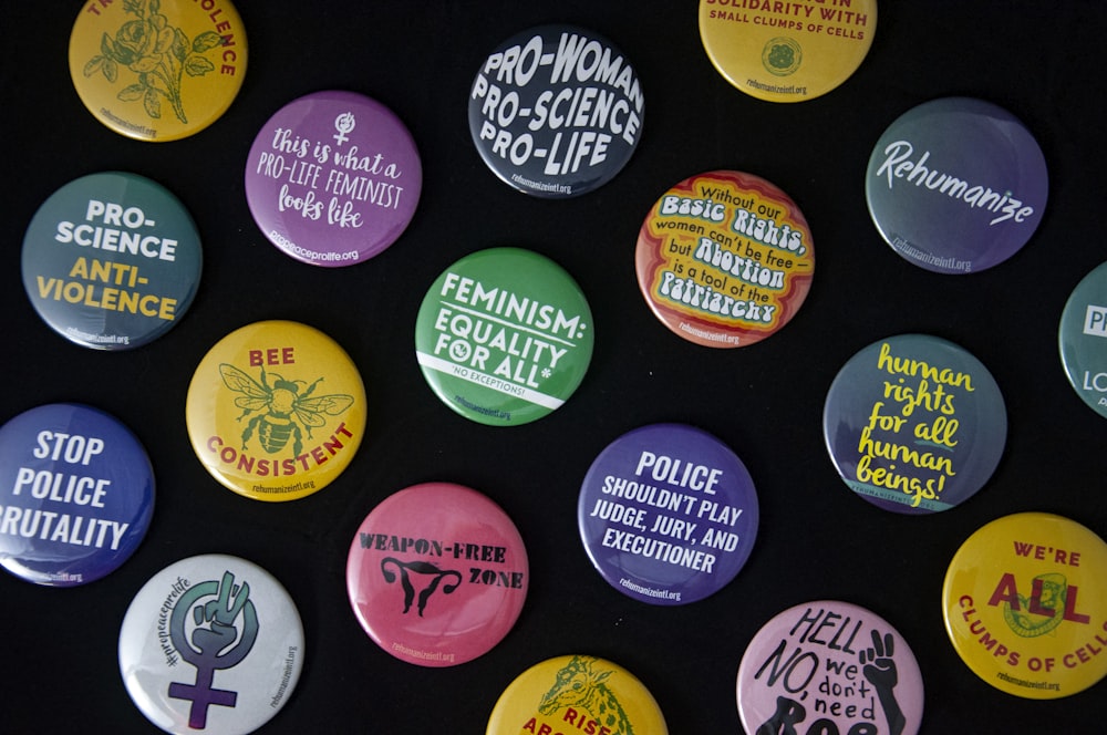 assorted-color pin back badges
