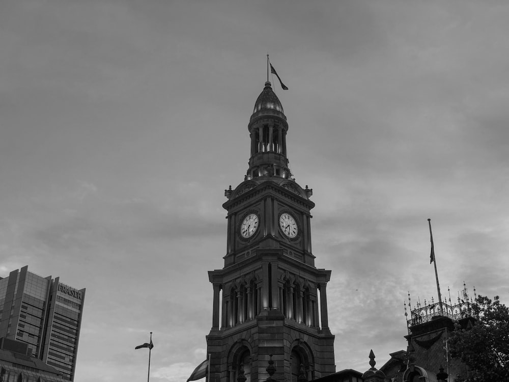 grayscale photo of clock tower
