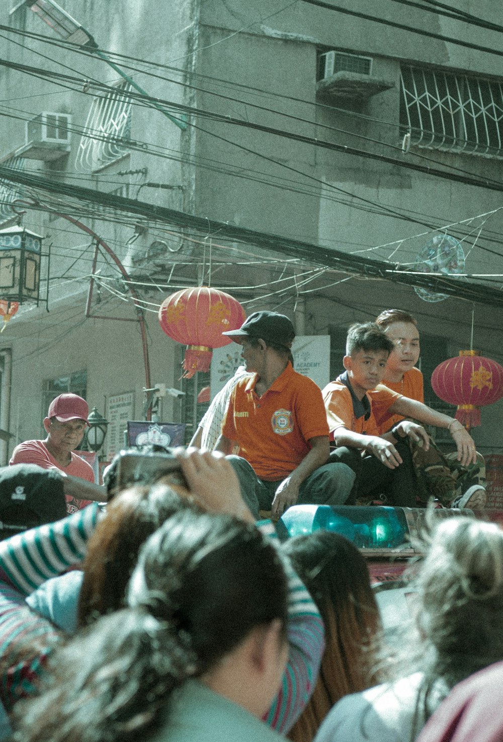 boy and men on vehicle