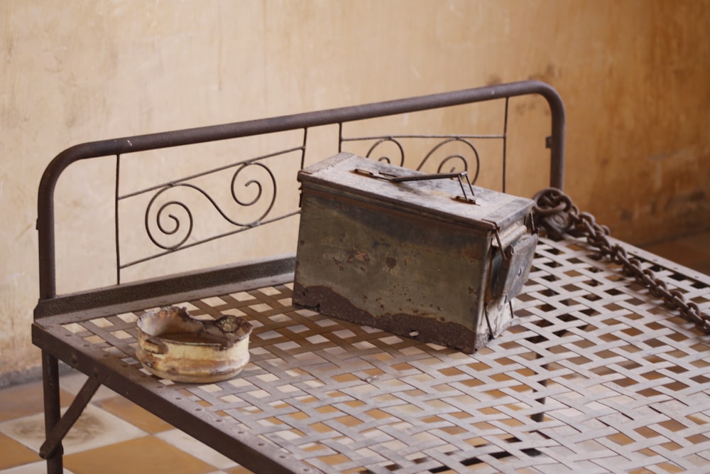 brown steel box in steel bed close-up photography