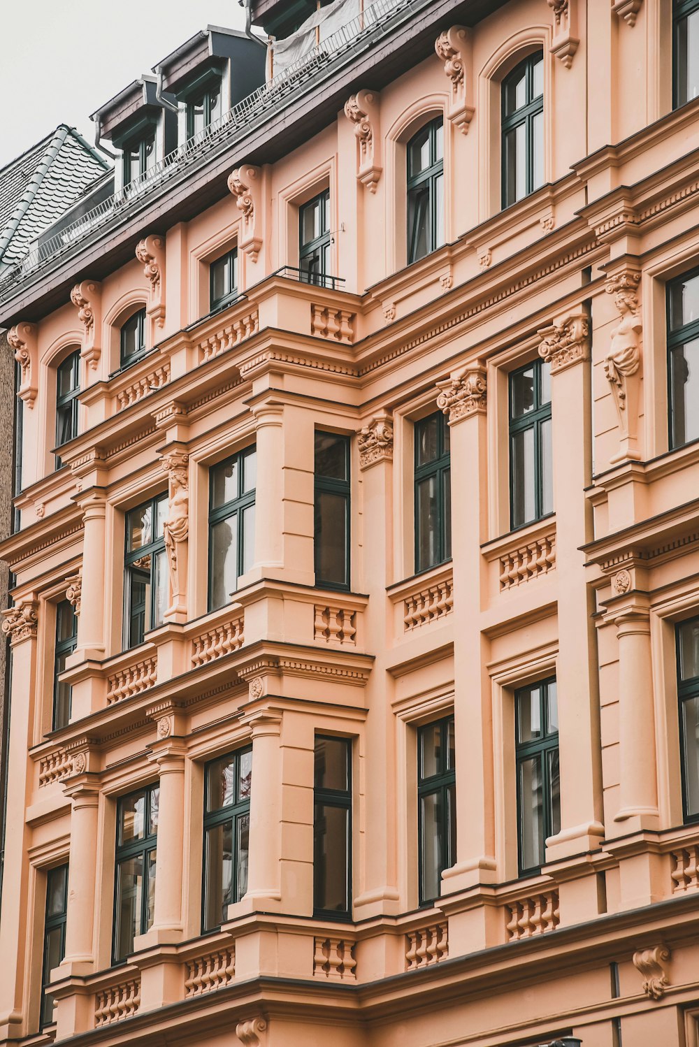 selective focus photography of beige concrete building