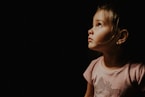 child wearing beige shirt