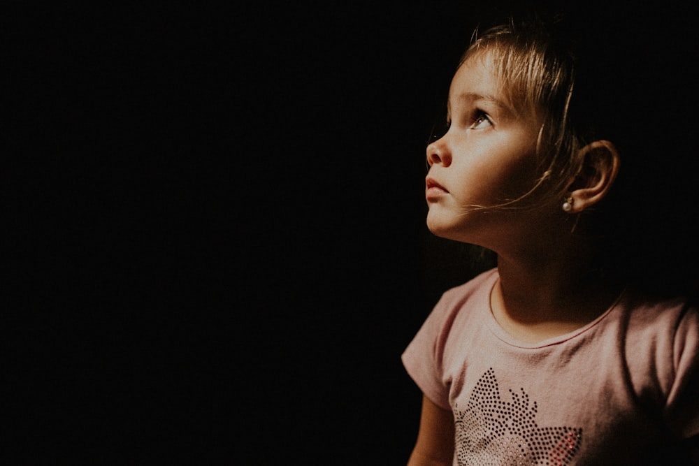 child wearing beige shirt