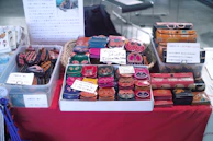 A table displaying handmade items for sale supporting Amigos Peludos PR.
