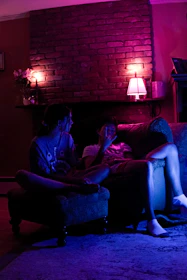 A warm digital living room scene with soft lighting and cozy furniture for two.