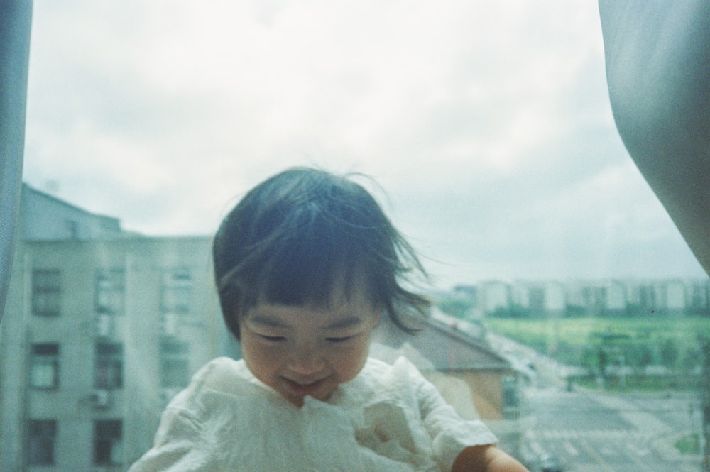 girl smiling wearing white dress