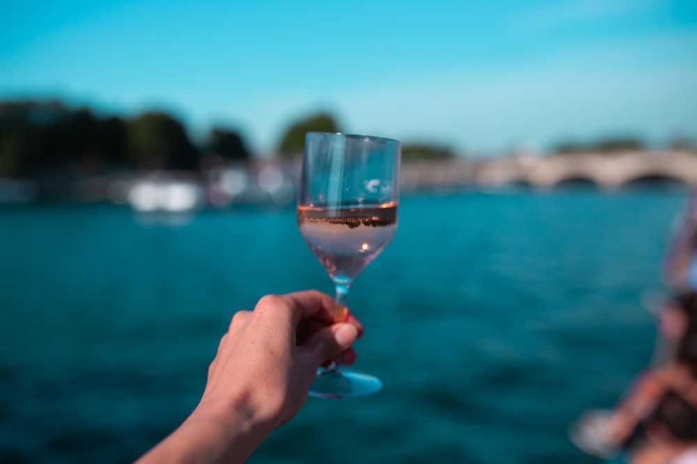 pink liquor on a clear wine glass