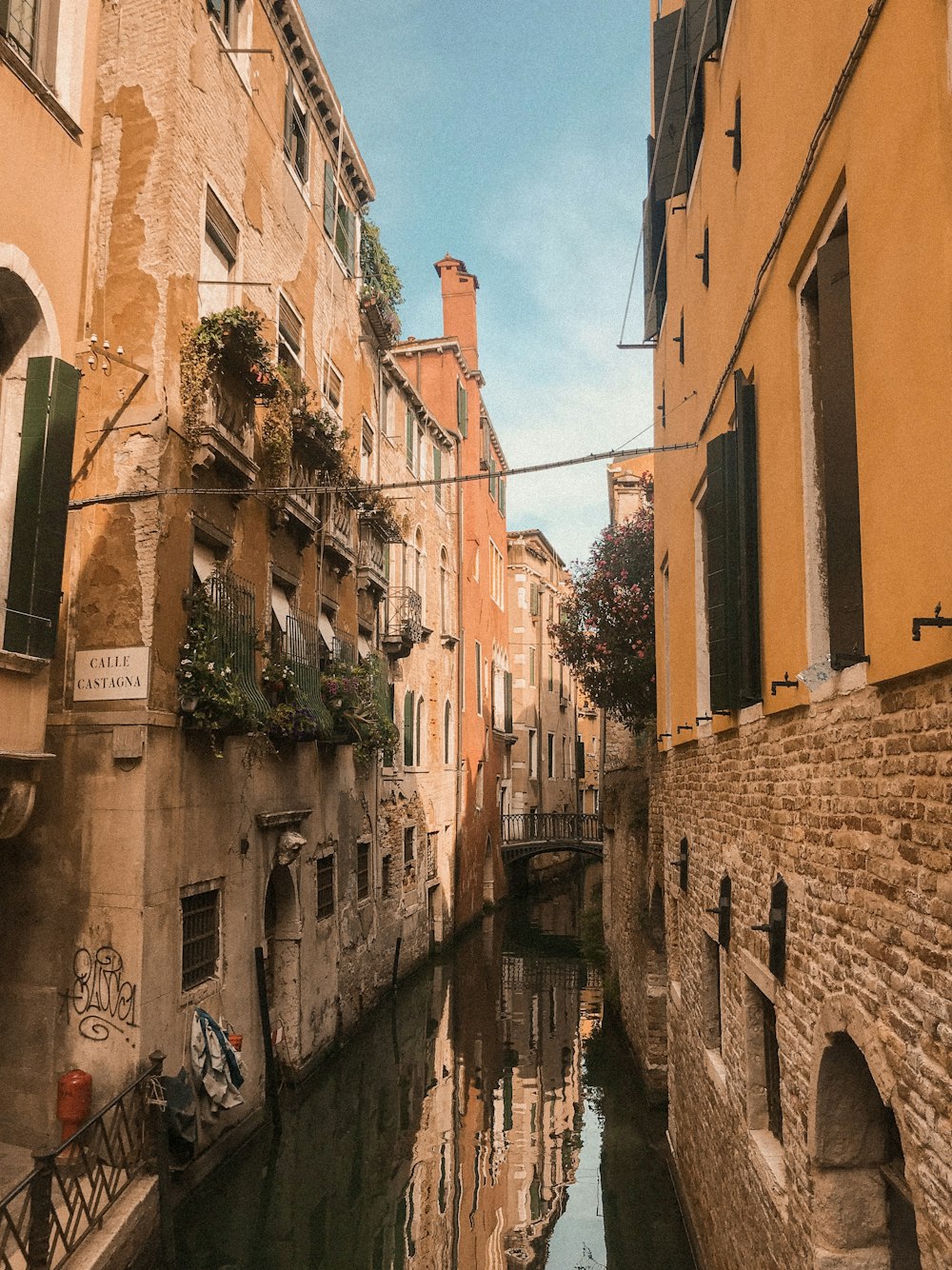 canal between concrete buildings