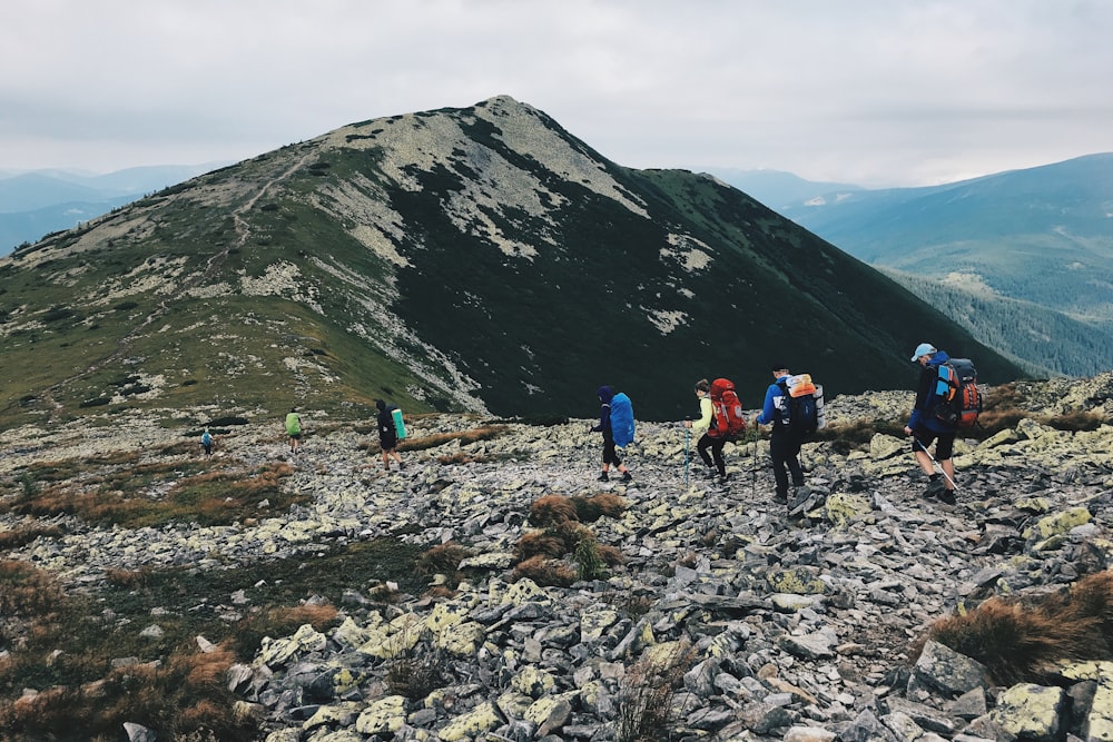 group of people at a rocky mountainside