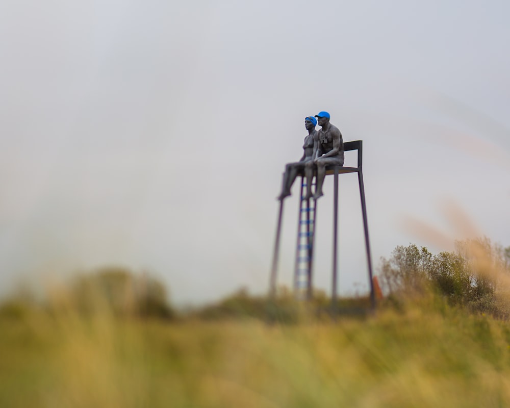 two person sitting on focus photography