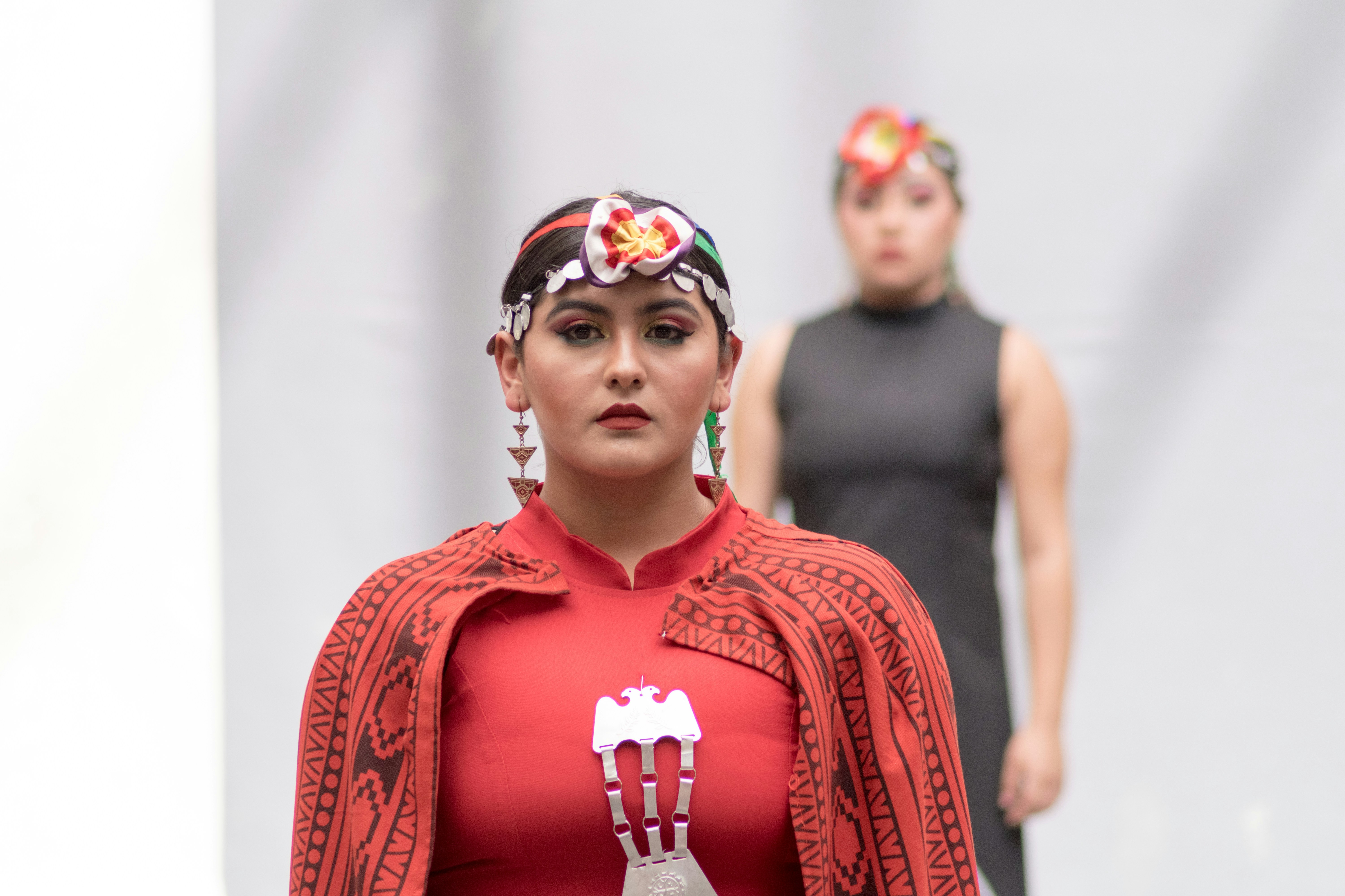 Fashion walk with cape and headdress