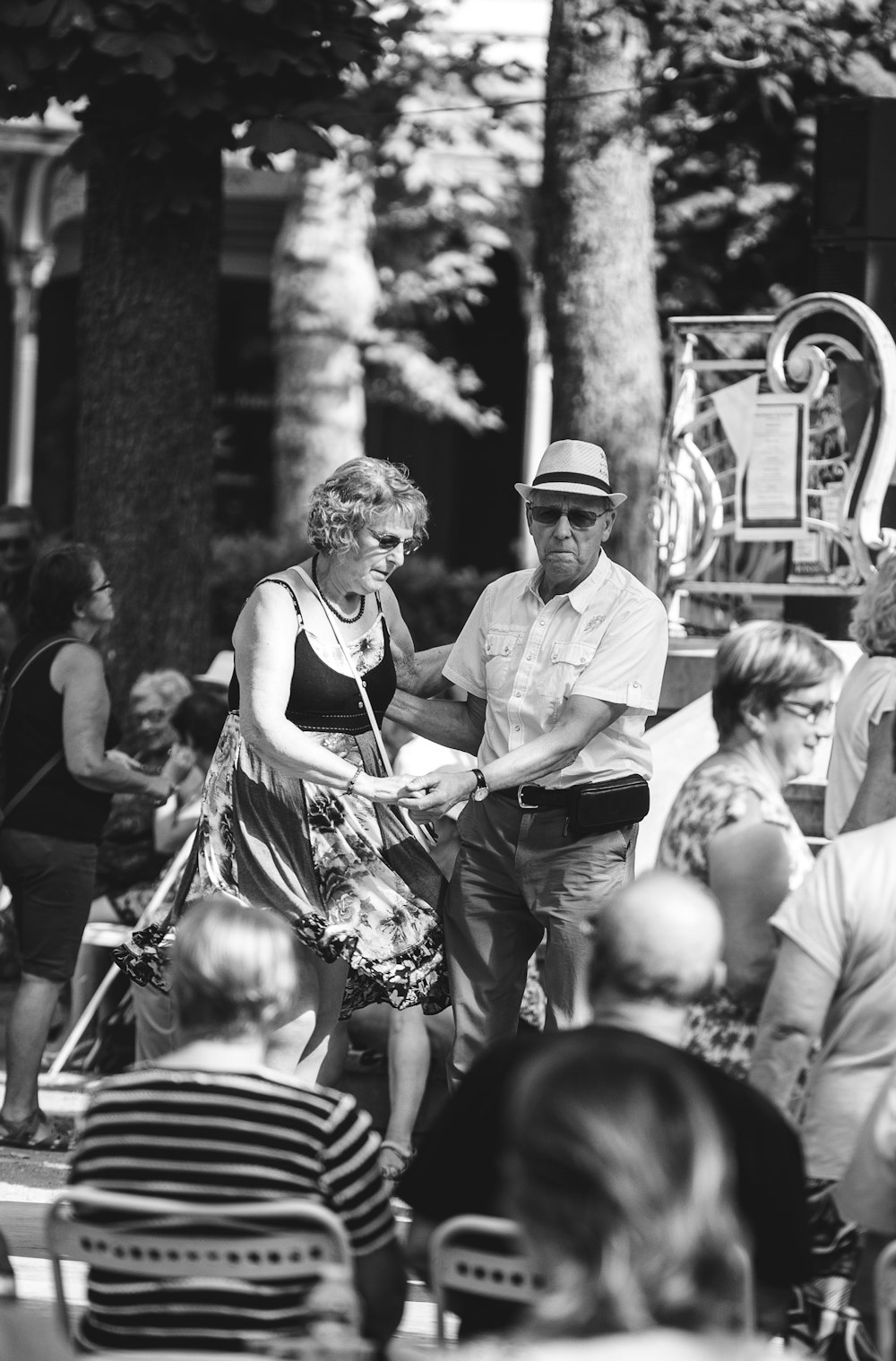 grayscale photo of a man and woman dancing