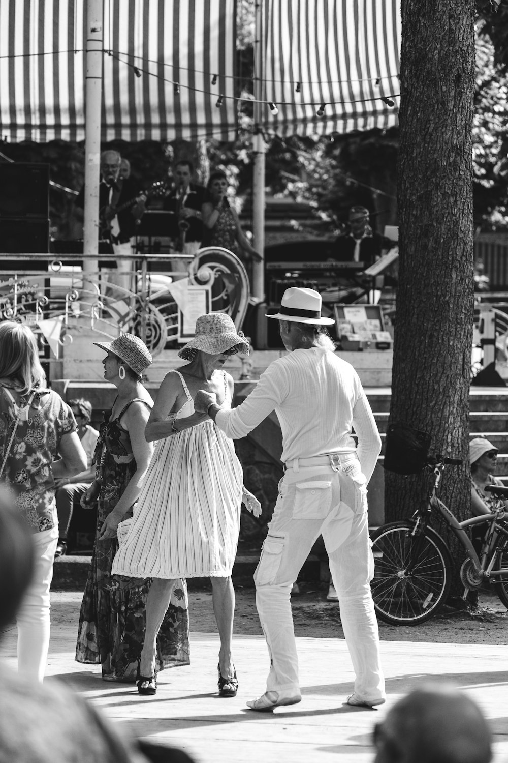 grayscale photo of a man and woman in white