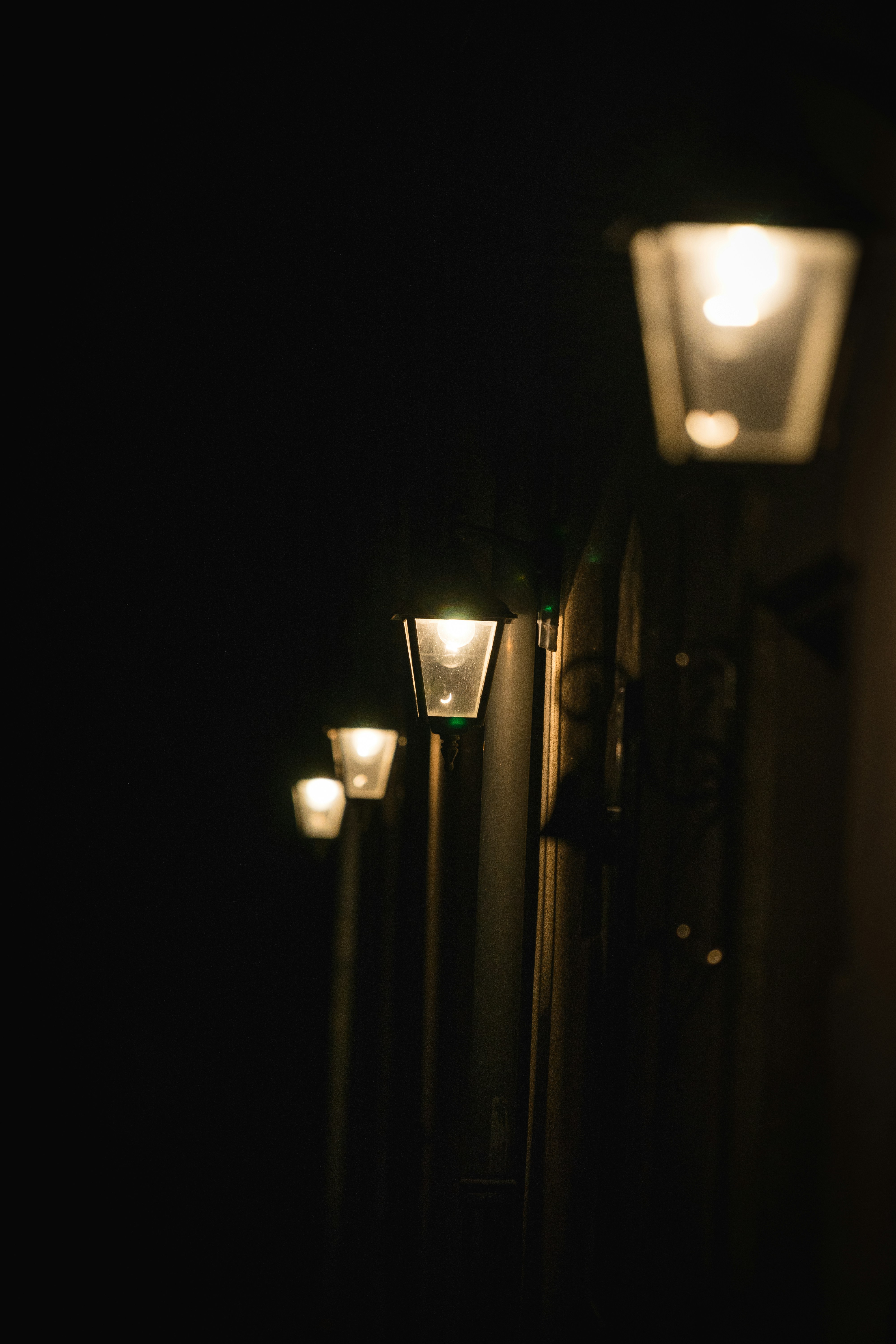 turnedon lamp posts at night photo Free Lamp post Image on Unsplash