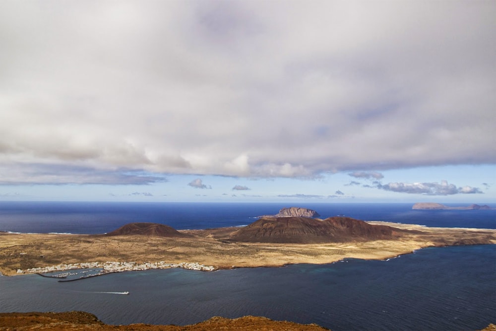 mountain ranges surrounded with body of water