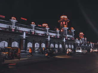 white and red concrete building at nighttime