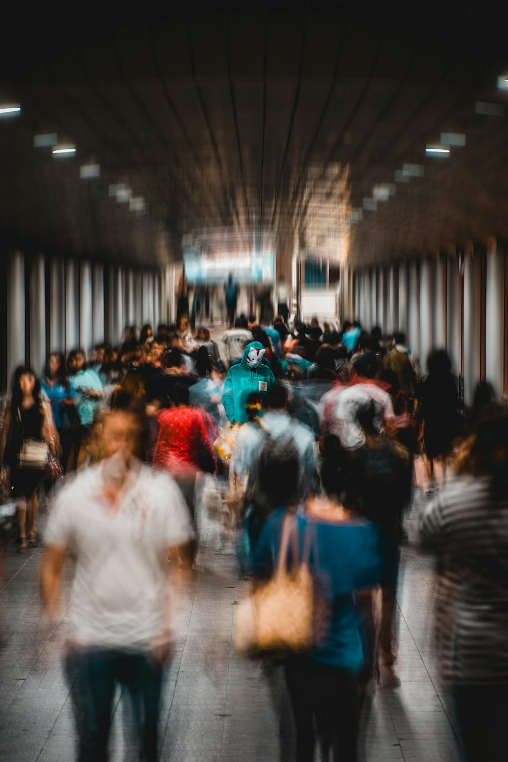 people walking inside tunnel