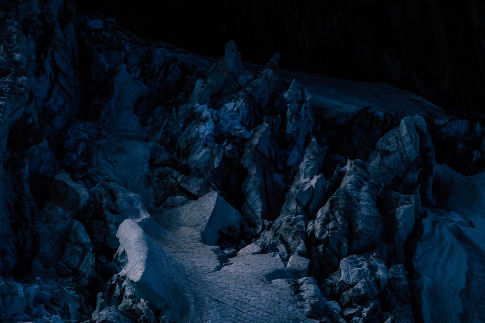 a mountain covered in ice and snow at night