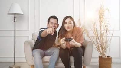 A cozy home setting with a parent and child playing video games together, showing connection.