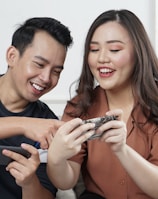 black man and woman siting on sofa chair inside room