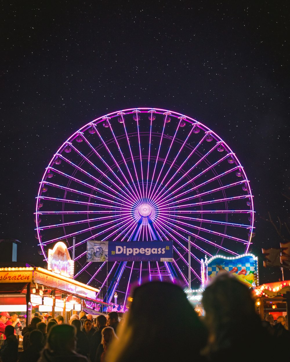 lighted ferris wheel at nighttime