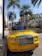 A happy customer receiving their new car in a sunny Los Angeles setting.
