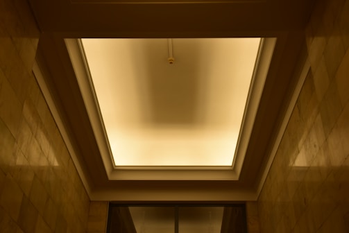 False ceiling installation with integrated lighting creating a warm atmosphere.