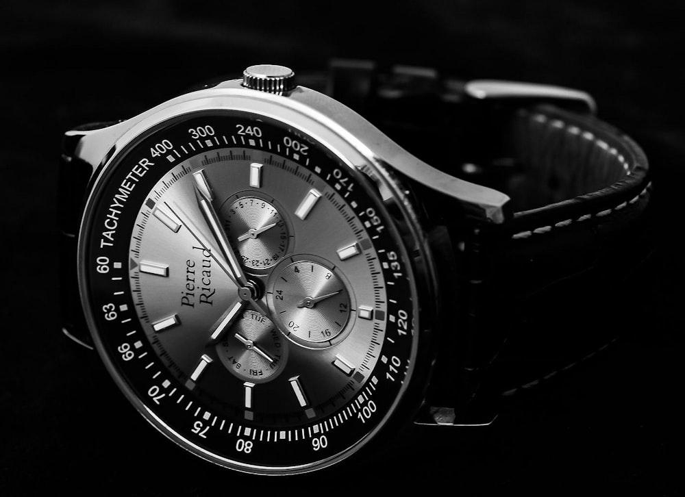 round silver chronograph watch