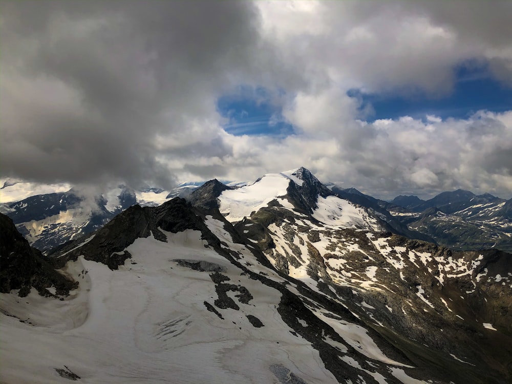 rock mountain covered with snow