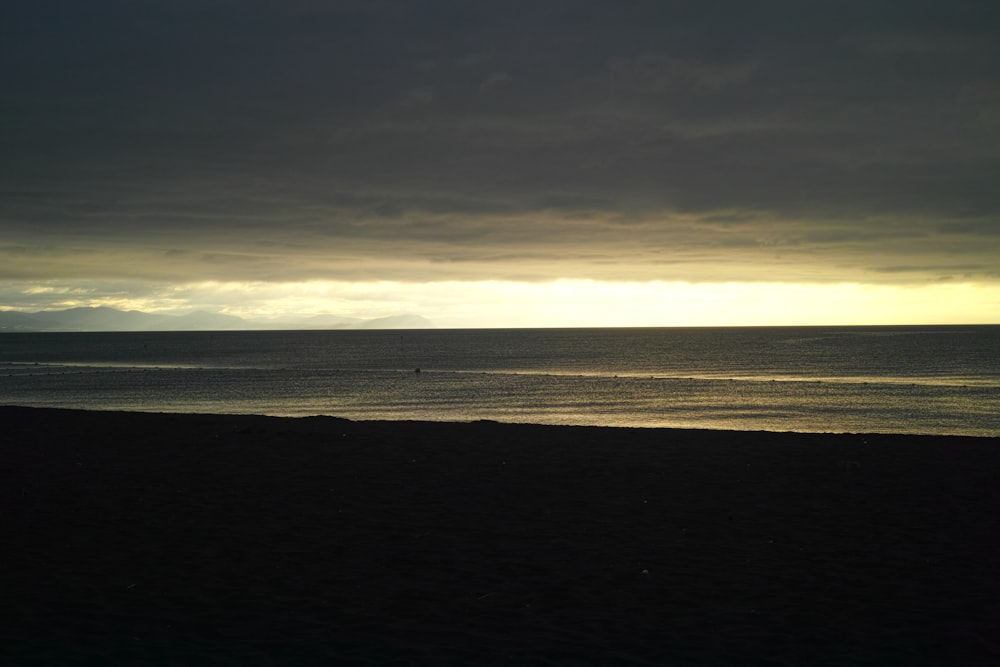 silhouette of shore during golden hour