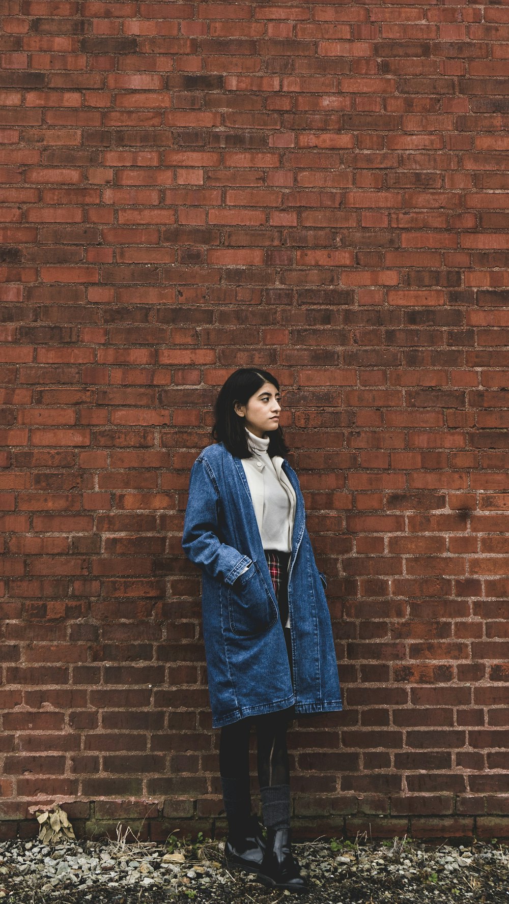 woman wearing blue denim coat