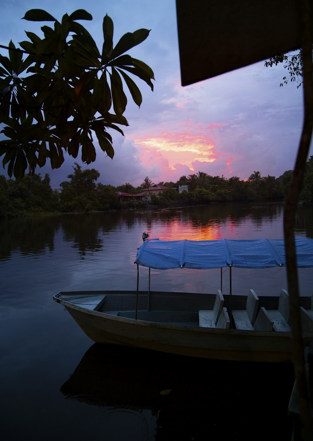 empty white boat on body of water