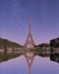 the eiffel tower is reflected in the water