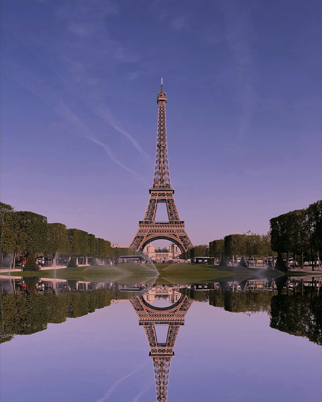 Classic view to the beautiful Eiffel tower with a mirror reflection (which is not real actually). Shot on iPhone X