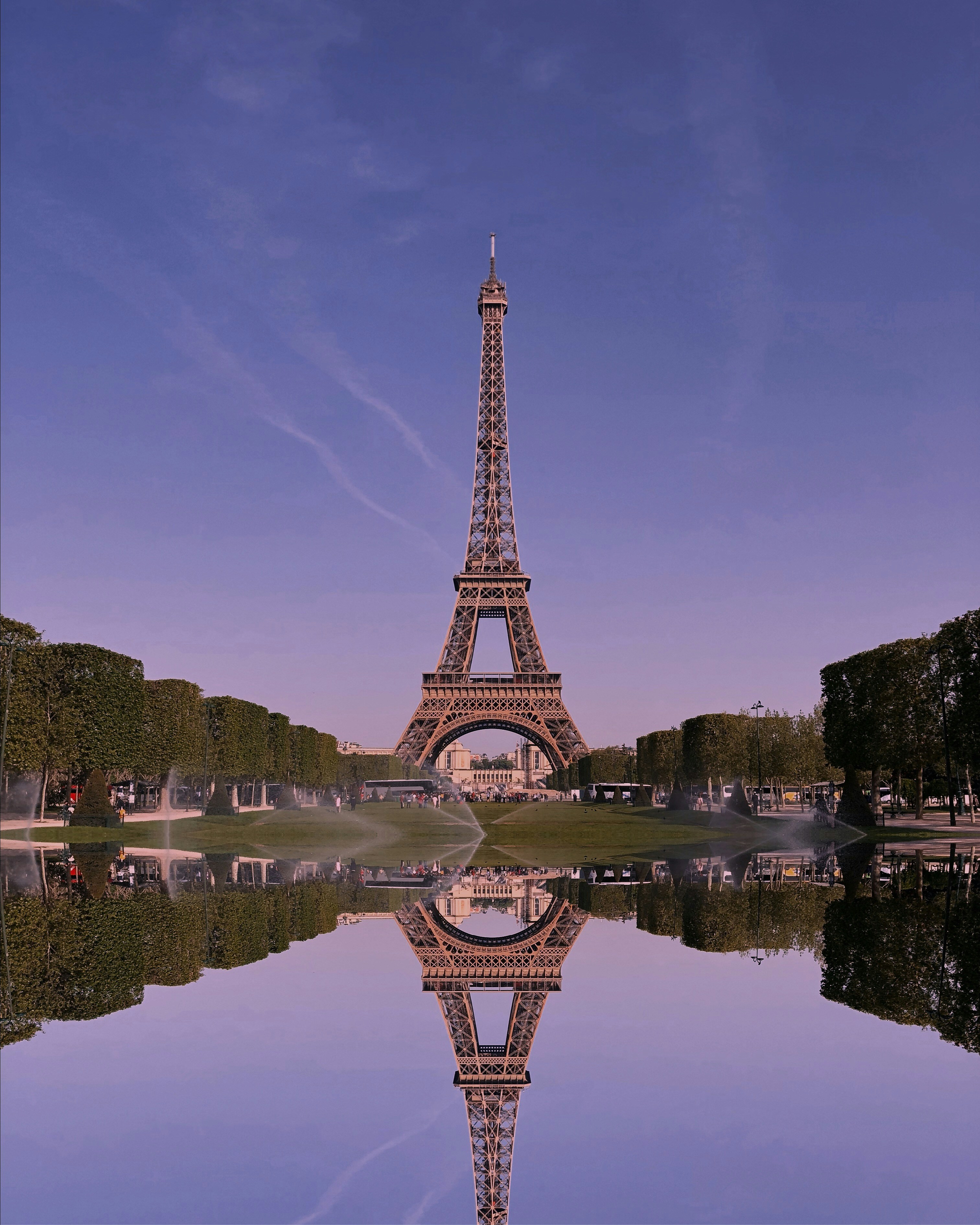 Classic view to the beautiful Eiffel tower with a mirror reflection (which is not real actually). Shot on iPhone X