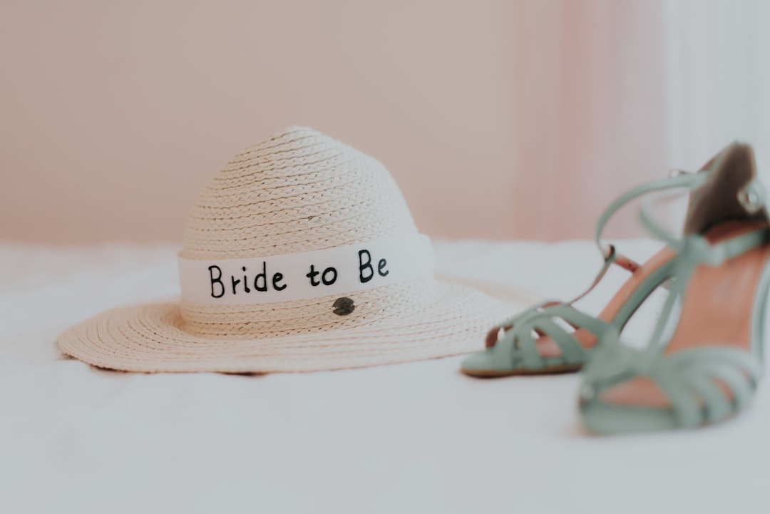 white hat near a heeled shoes close-up photography