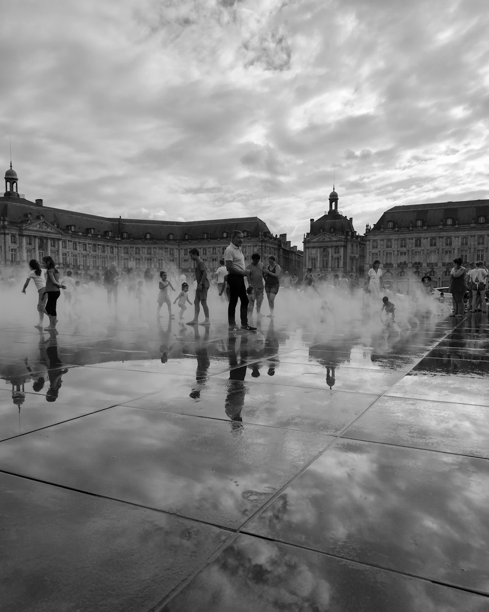 people standing on outdoor water sprinkler park