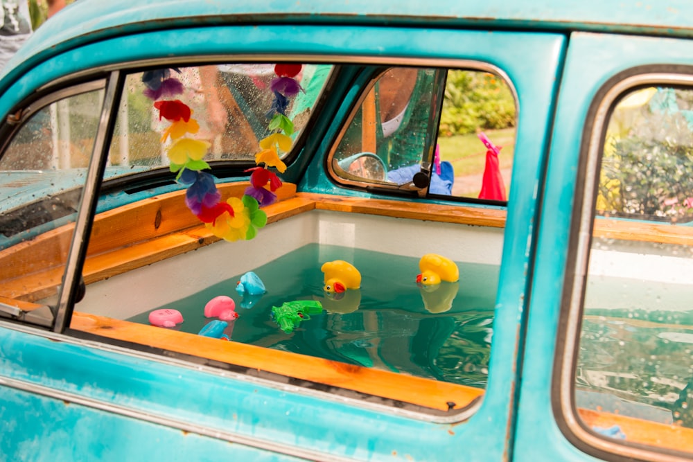classic vehicle filled with water and rubber toys