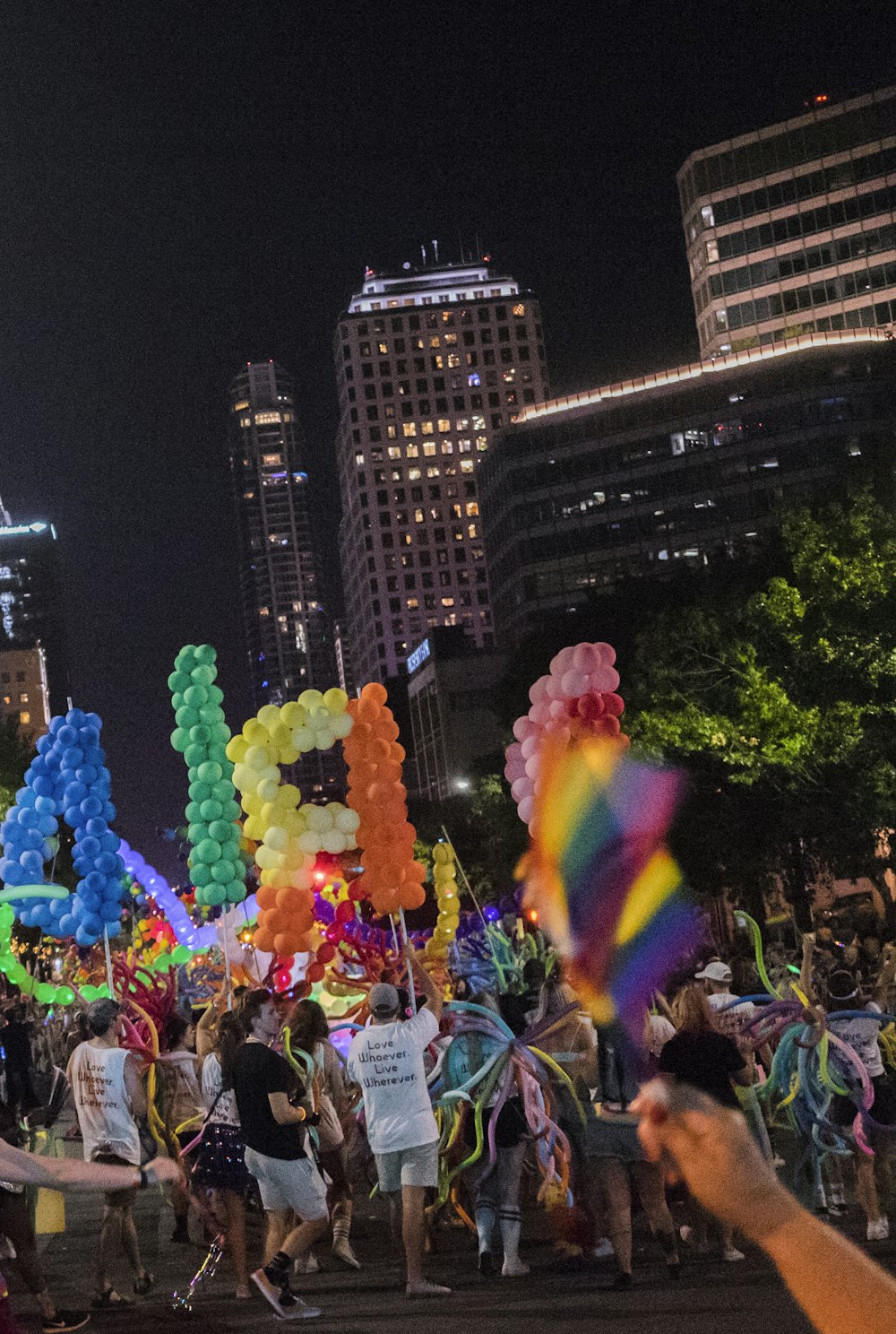 people holding balloons