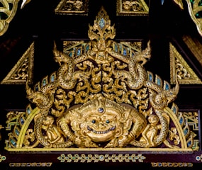 Ornate wooden carved music box featuring detailed animal motifs.