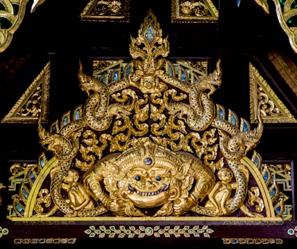 Ornate wooden carved music box featuring detailed animal motifs.