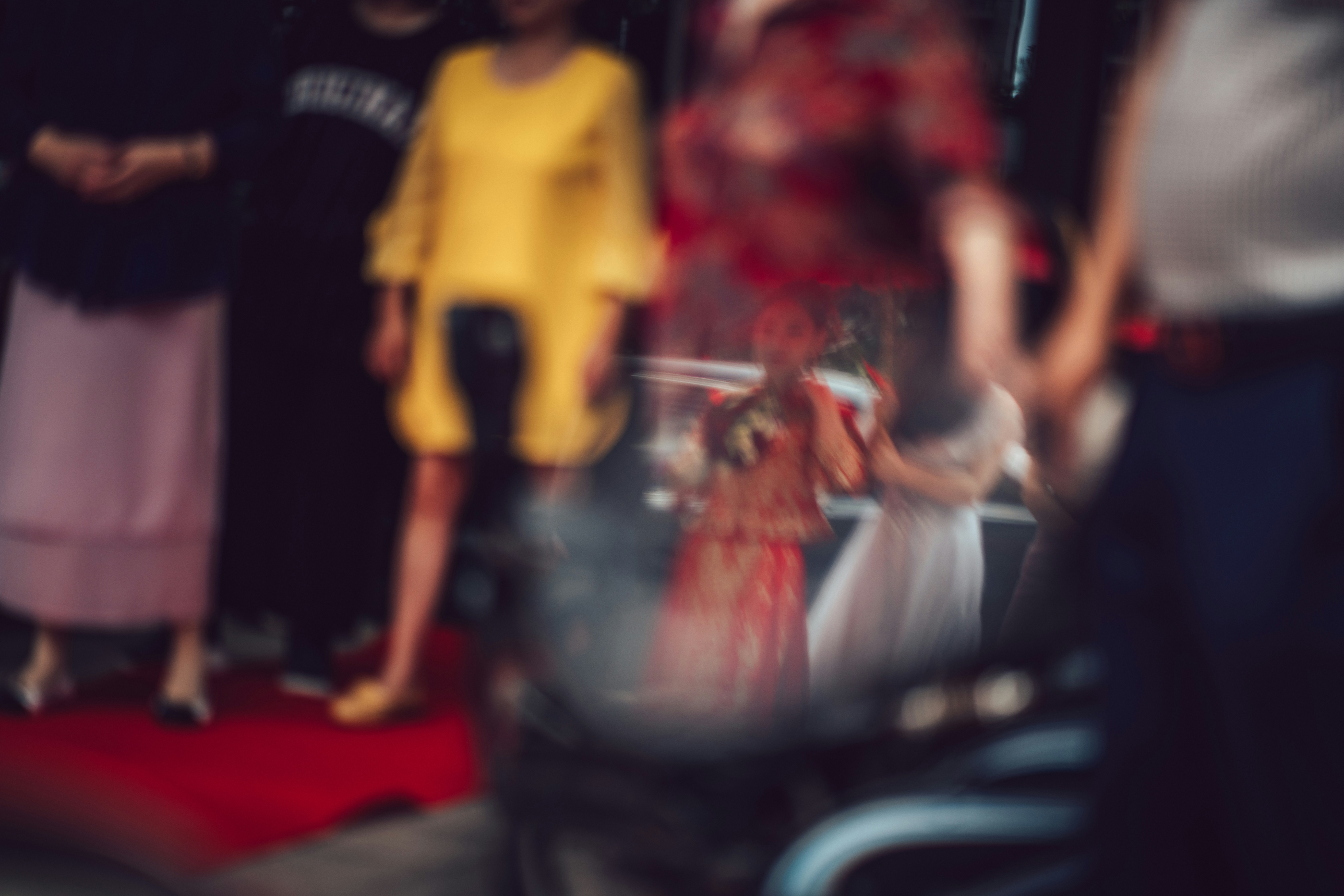 a blurry photo of a group of people on a red carpet