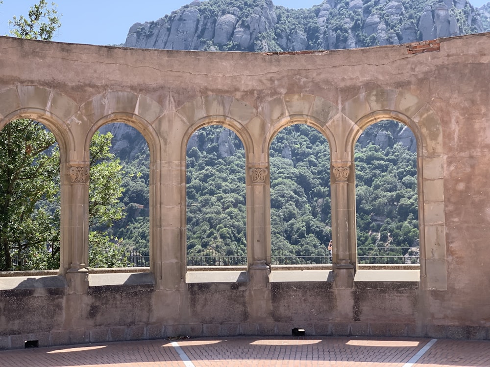 brown concrete building near mountain during daytime