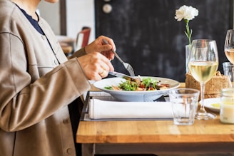 person eating vegetable salad