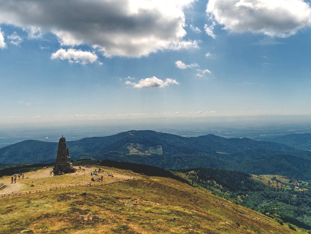 a view of a hill with a tower on top of it