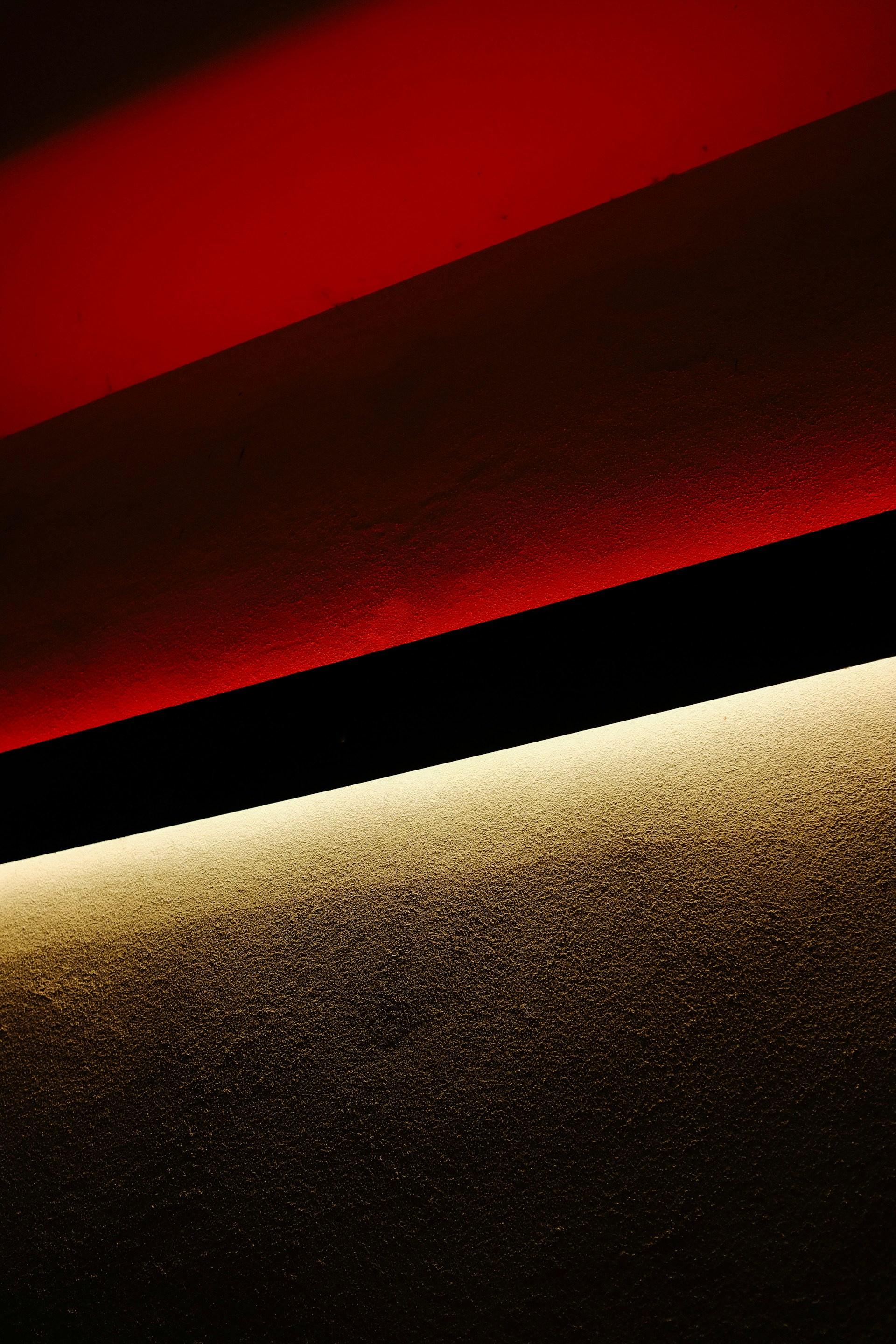 a close up of a wall with a red light