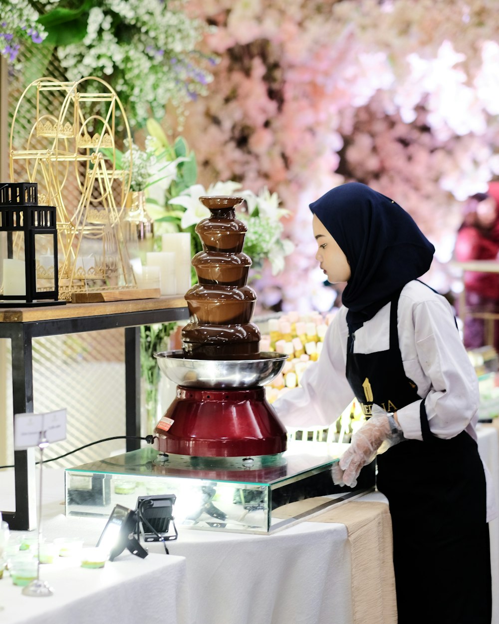 man standing near chocolate fountain